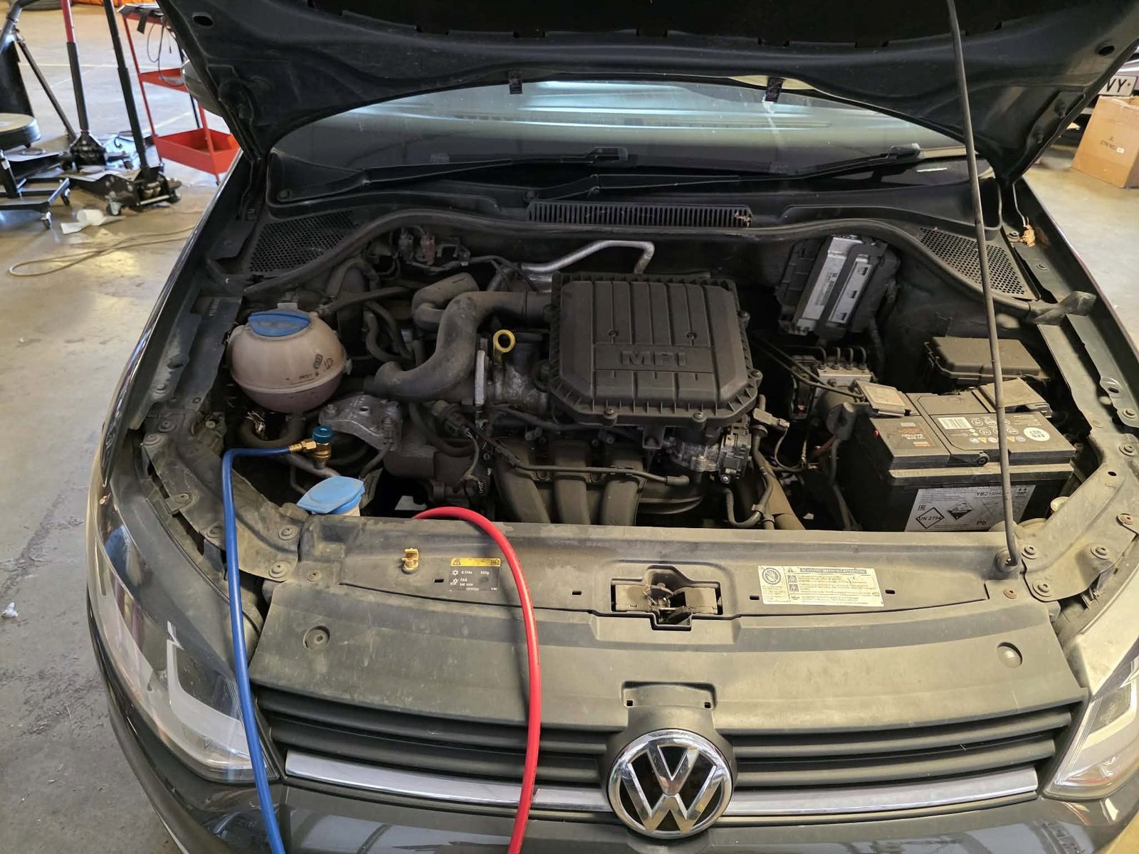 Air con service hoses connected in a Volkswagen engine bay