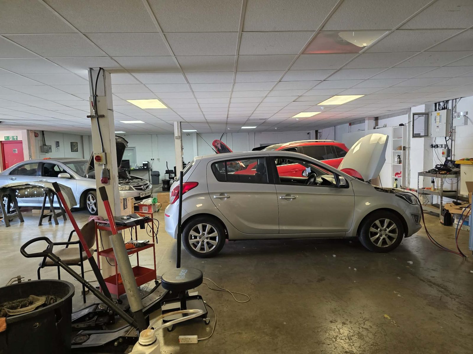 Silver Hyundai in the workshop with tools and equipment around it