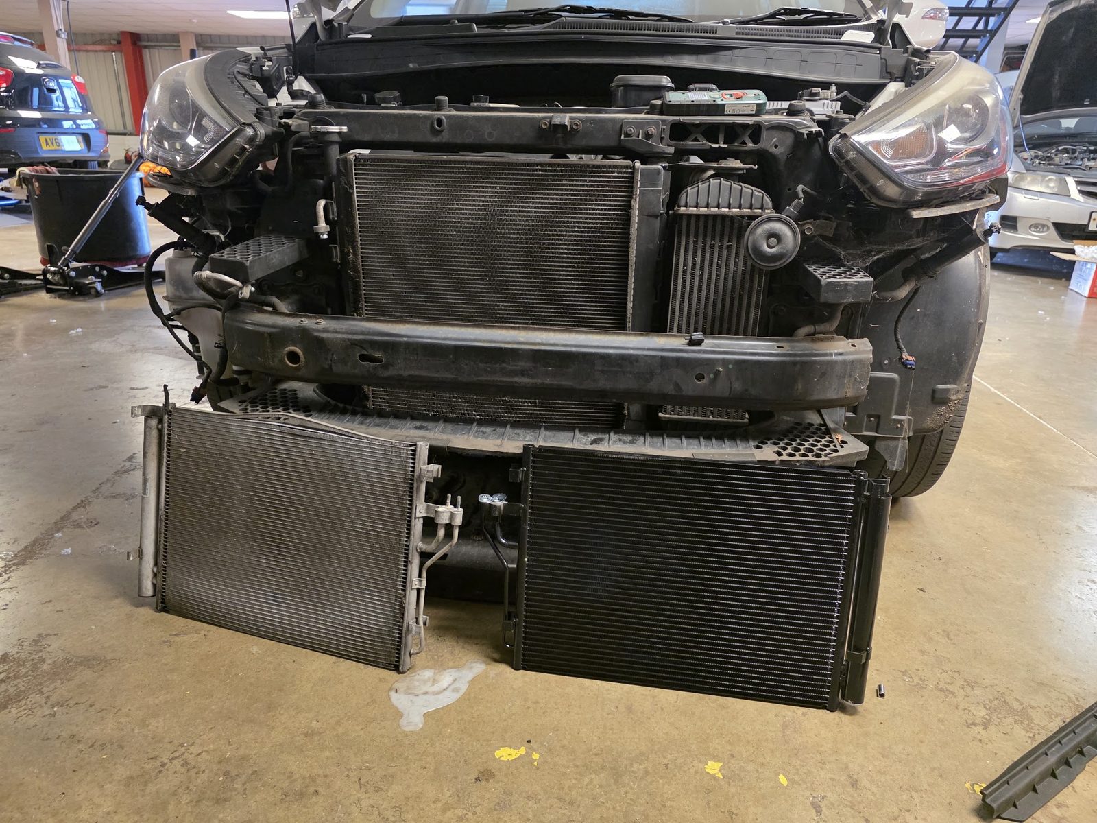Car front end stripped with the radiator and condenser out